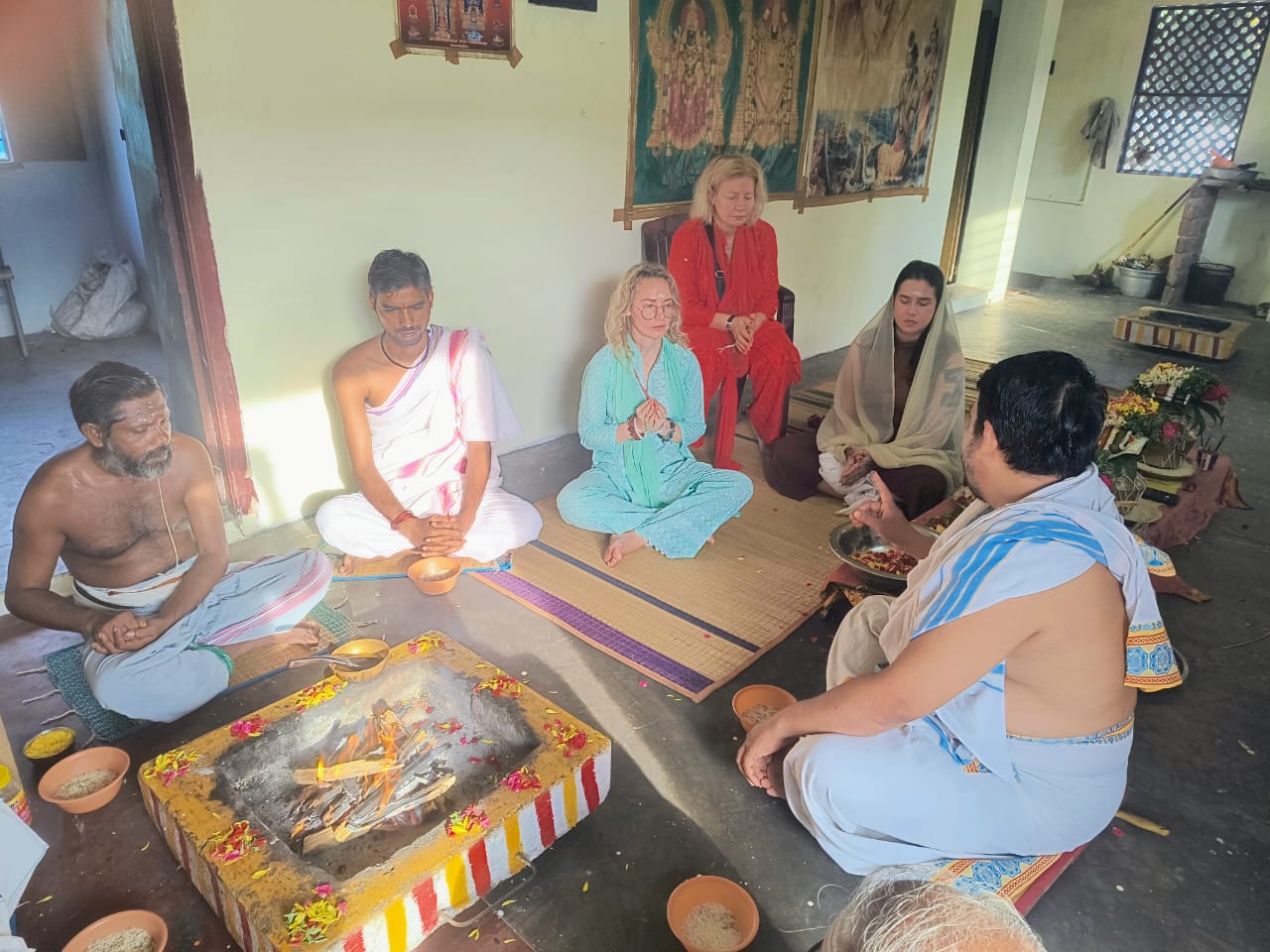 Pandit Pradeep Bhargava performing a sacred Homam fire ritual with ghee and offerings in Rameswaram India